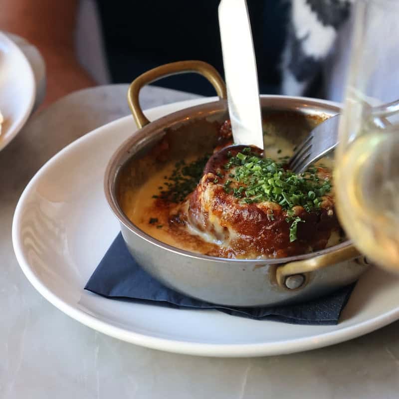 Twice baked soufflé suissesse in a copper pan